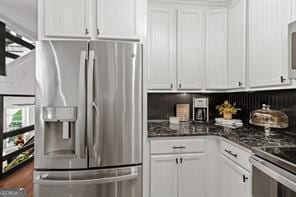 kitchen with appliances with stainless steel finishes and white cabinetry