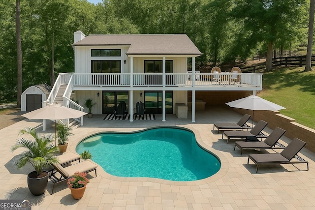 6505 Samoa Way, Flowery Branch, GA 30542 - rear view of property with stairway, a patio area, board and batten siding, a chimney, and a balcony