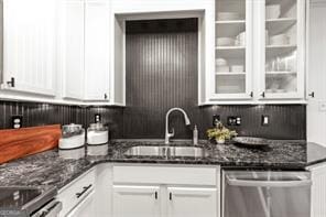 6505 Samoa Way, Flowery Branch, GA 30542 - kitchen with dishwasher, a sink, white cabinetry, tasteful backsplash, and dark stone counters