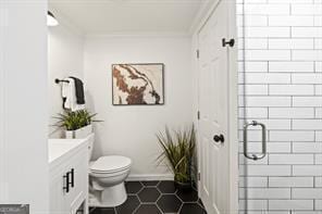 full bath with tile patterned floors, toilet, a stall shower, ornamental molding, and vanity