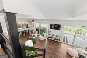 living area with a ceiling fan, plenty of natural light, and wood finished floors