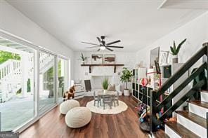 interior space featuring stairs, wood finished floors, and ceiling fan