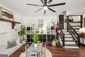 interior space with wood finished floors and ceiling fan