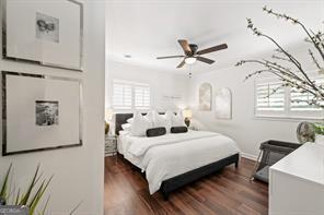 bedroom with dark wood-type flooring