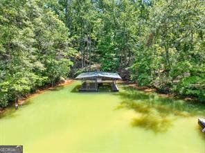 6505 Samoa Way, Flowery Branch, GA 30542 - view of swimming pool with a lawn