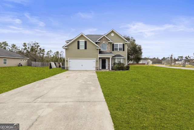 traditional-style house featuring driveway, a front yard, an attached garage, and fence