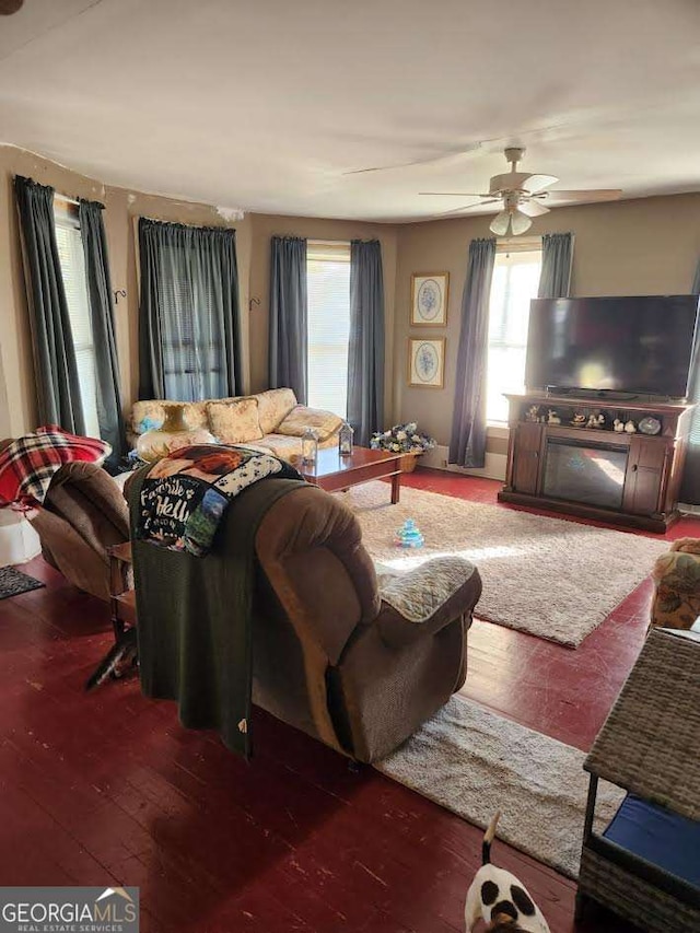 living room with hardwood / wood-style floors and a ceiling fan