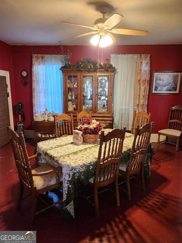 dining space featuring ceiling fan and wood finished floors