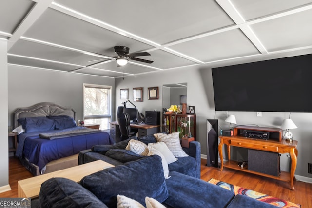 bedroom featuring a ceiling fan, wood finished floors, baseboards, and coffered ceiling