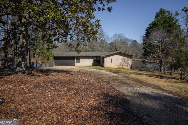 single story home featuring a garage