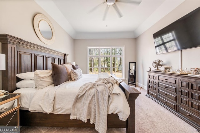 carpeted bedroom featuring baseboards and a ceiling fan