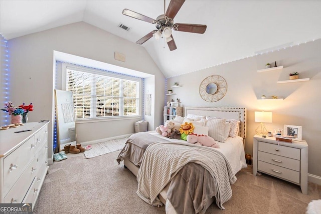 carpeted bedroom with lofted ceiling, a ceiling fan, visible vents, and baseboards