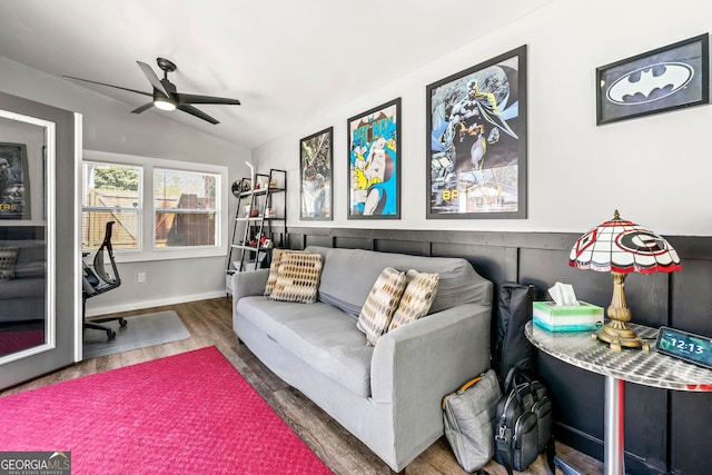 living area with vaulted ceiling, wood finished floors, and ceiling fan