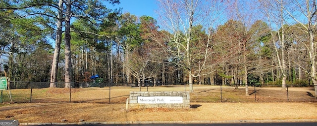 view of property's community featuring fence