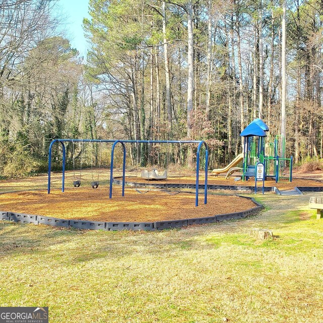 community play area featuring a lawn