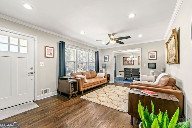 living room with dark wood-type flooring, recessed lighting, and ornamental molding