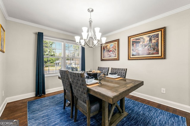 dining room with baseboards, an inviting chandelier, wood finished floors, and crown molding