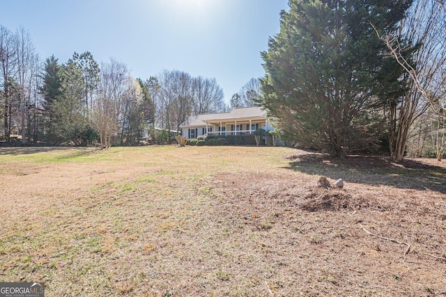 view of yard with a porch