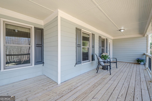 wooden deck featuring covered porch