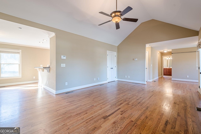 unfurnished living room with visible vents, wood finished floors, baseboards, and ceiling fan