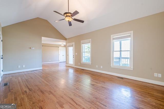 spare room featuring baseboards, a ceiling fan, visible vents, and light wood-type flooring