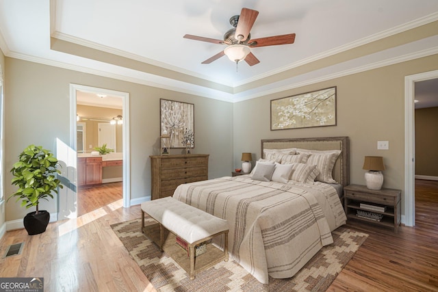 bedroom featuring visible vents, baseboards, and light wood finished floors