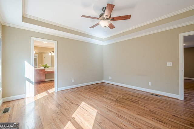 unfurnished room with visible vents, baseboards, light wood-style floors, and ceiling fan