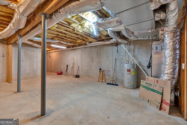 unfinished basement featuring water heater