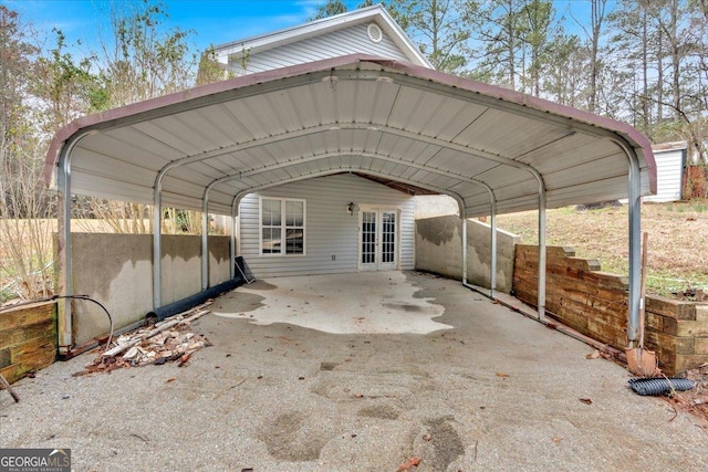 view of parking featuring french doors and a detached carport