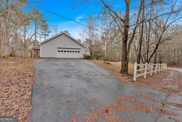 view of side of home with a garage