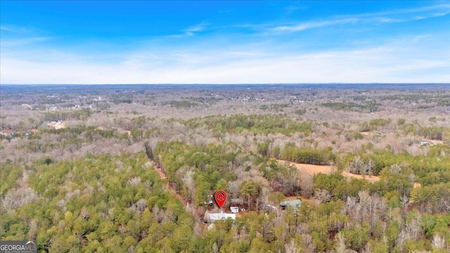 aerial view with a wooded view