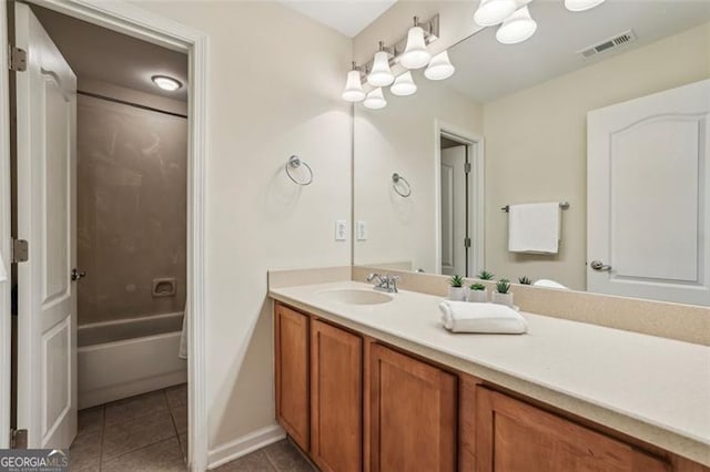 bathroom with visible vents, baseboards, bathtub / shower combination, tile patterned floors, and vanity