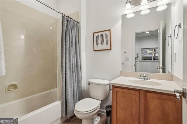 bathroom with vanity, shower / bath combination with curtain, and toilet