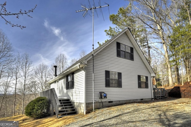 view of side of property with crawl space