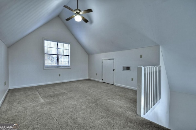 additional living space featuring visible vents, baseboards, carpet flooring, lofted ceiling, and ceiling fan