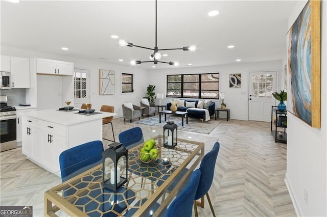 dining room with recessed lighting and baseboards