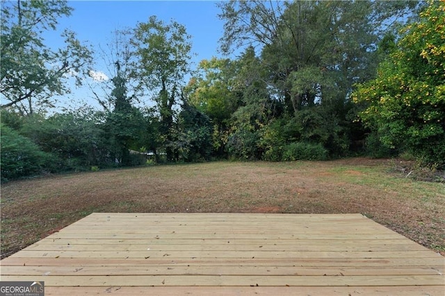 deck featuring a lawn