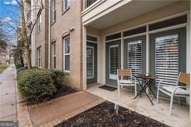 exterior space with brick siding