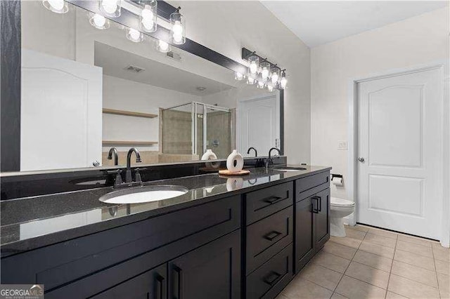 full bath with tile patterned flooring, a shower stall, double vanity, and a sink