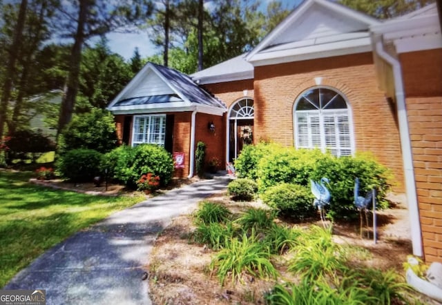 view of front of home with brick siding