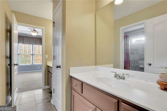 bathroom featuring vanity, tile patterned floors, and baseboards