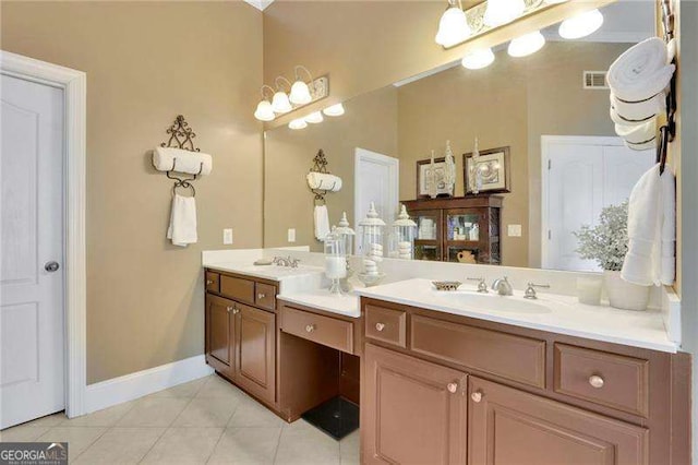 bathroom with tile patterned floors, visible vents, double vanity, and a sink