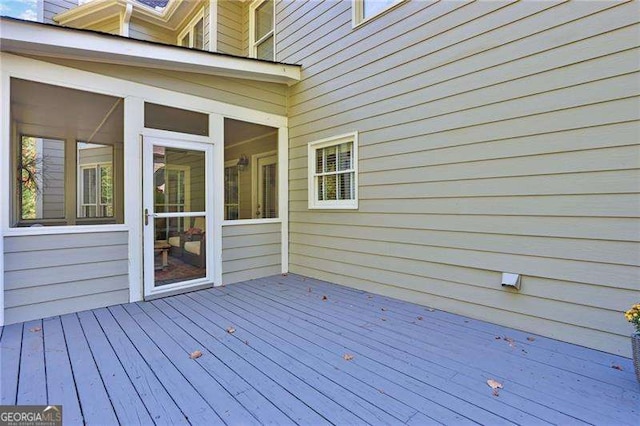 wooden terrace with a sunroom