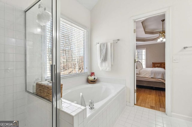 ensuite bathroom featuring a shower stall, a bath, crown molding, and connected bathroom