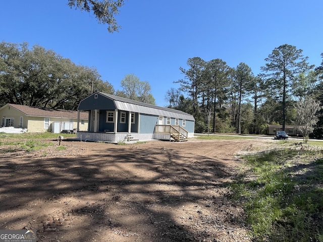 exterior space with a gambrel roof