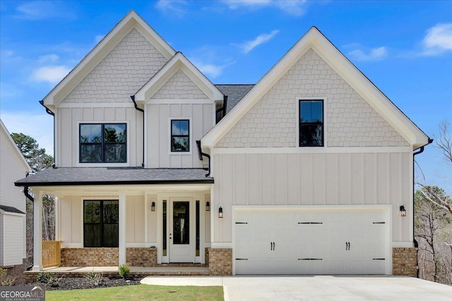 modern farmhouse style home featuring a garage, covered porch, board and batten siding, and concrete driveway