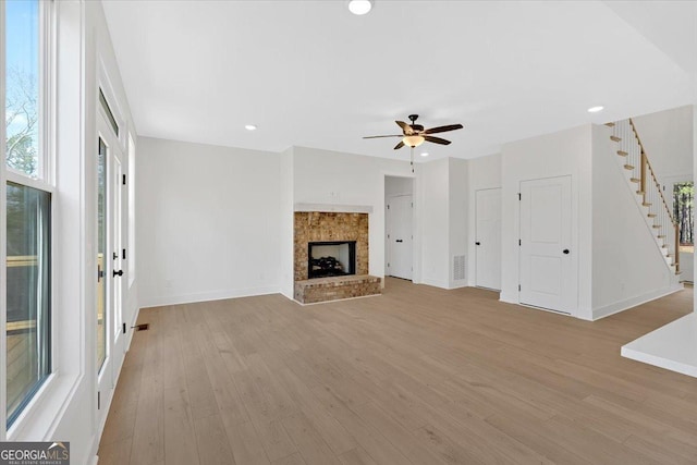 carpeted spare room with ceiling fan and baseboards