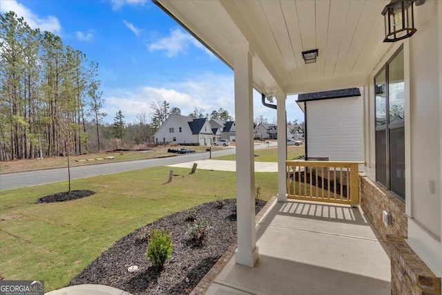 kitchen featuring a sink, wood finished floors, stainless steel appliances, white cabinets, and light countertops