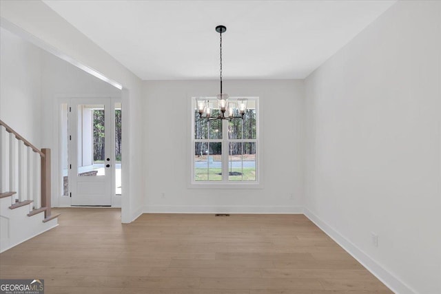 carpeted spare room with baseboards