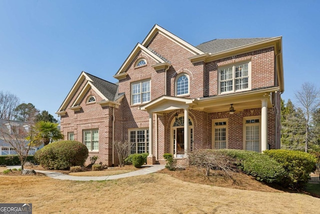 view of front of house featuring brick siding